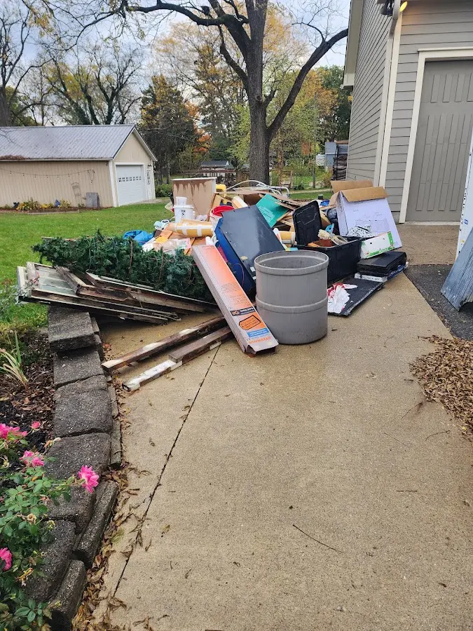 Dumpster being loaded with debris for 30 Yard Dumpster Rental in Chino Valley